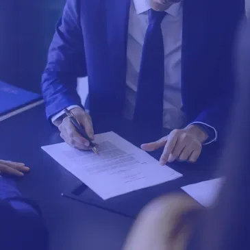 Advisor reviewing a contract with a client